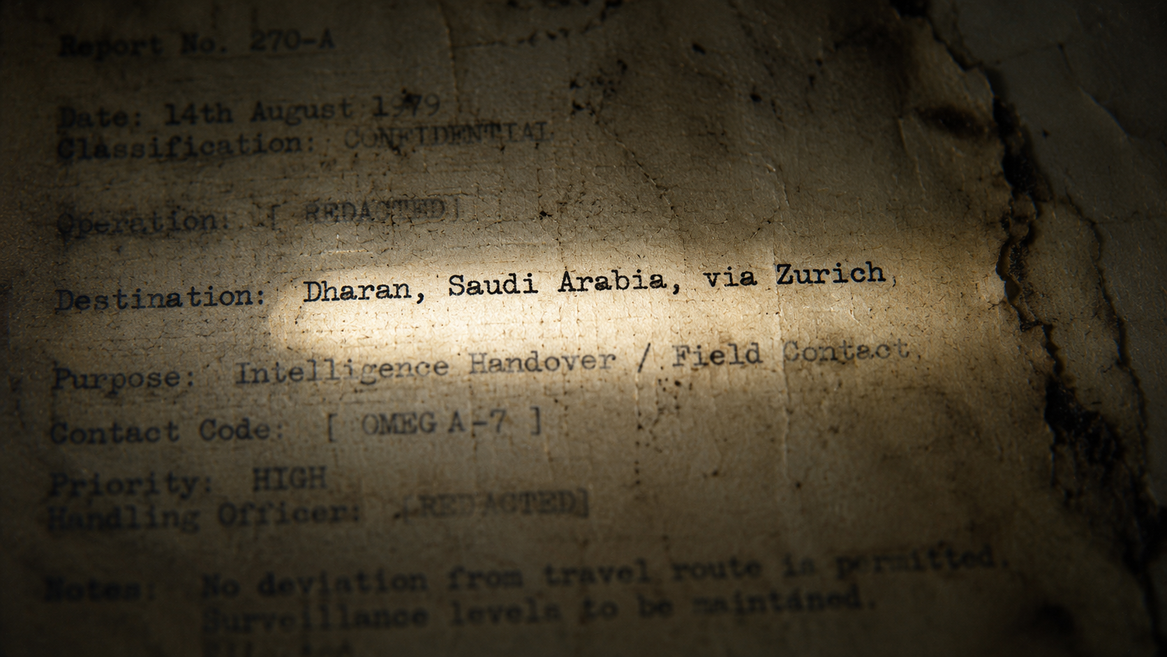 A macro detail shot of a degraded 1979 intelligence cable document highlighting a flight path under a harsh flashlight beam.